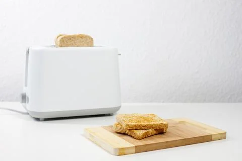 Toaster with bread inside on the table. breakfast, lunch. Foto stock