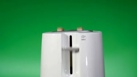 Toaster with fried bread against green background , slow motion. Food team Video stock 124947572