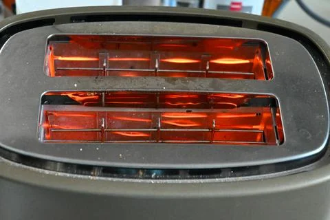 Toaster heating bread slots Stock Photos
