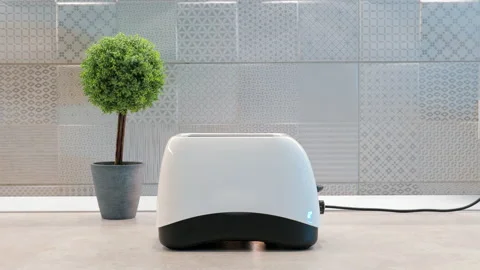 Toaster in Kitchen Making Toasts at Breakfast. Bread jump out from it. Stock Footage 158239454