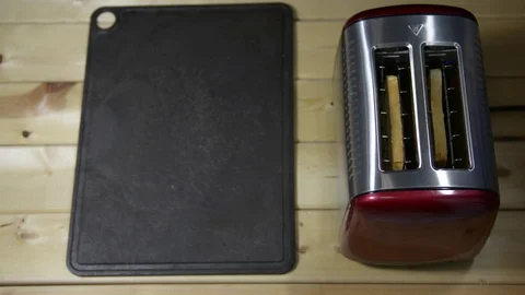 Toaster in the kitchen shoots toasted bread. Breakfast Stock Footage 122123262