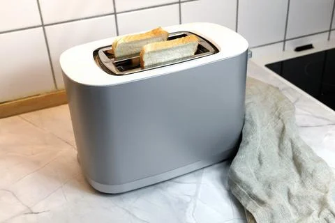 Toaster with two pieces of bread Stock Photos