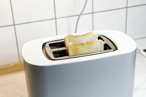 Toaster with two pieces of fried bread Stock Photos