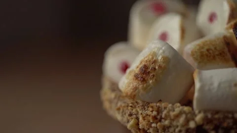 Toasting and caramelizing marshmallows using culinary torch Stock Footage 141276992