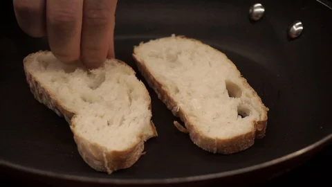 Toasting bread in dry skillet Stock Footage 113527513