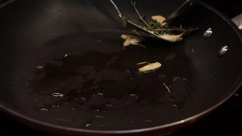 Toasting bread in oil Stock Footage 113527665
