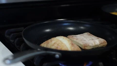 Toasting bread in a pan, cooking, 4k, real time Stockbeeldmateriaal 248542280