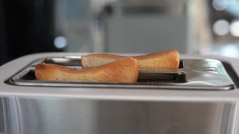 Toasting bread slices in modern toaster Video stock 308754036