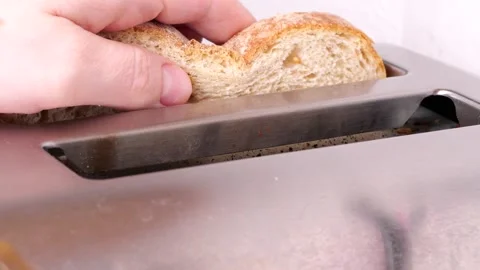 Toasting bread in slow motion, close up Stock Footage 306415791