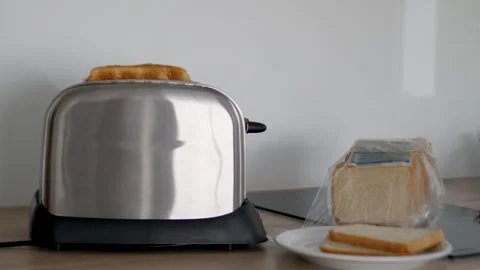 Toasting Bread with Style in a Modern Kitchen to Use a Toaster Stock Footage 317005777