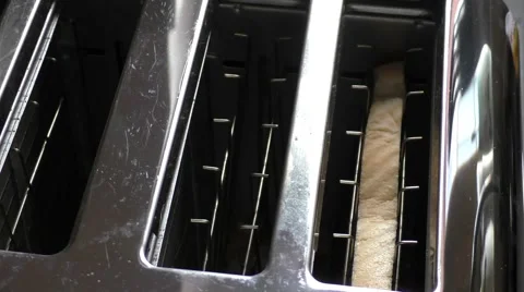 Toasting bread in a toaster Stock Footage 46195146