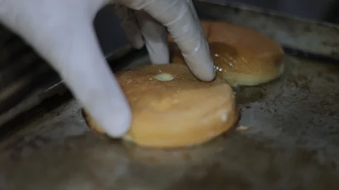 Toasting Burger Bread In Professional Kitchen Stock Footage 129033576