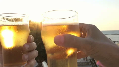 Toasting with cold beer mugs in summer Video stock 115709357
