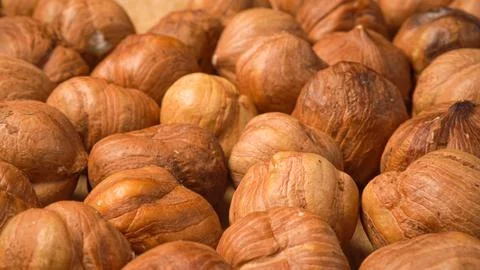 Toasting hazelnuts close-up. Lots of kernel nuts Fotos Stock
