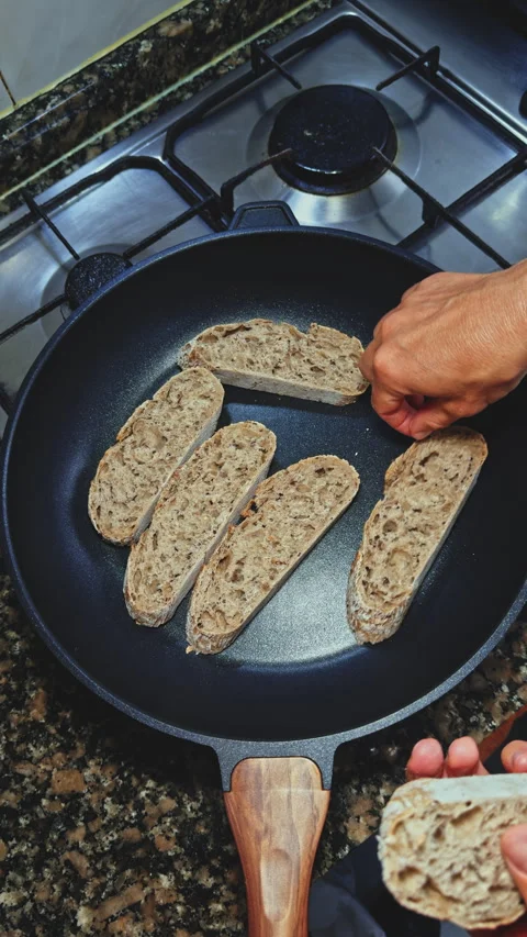 Toasting Multigrain Bread in Pan Stock Footage 277724637