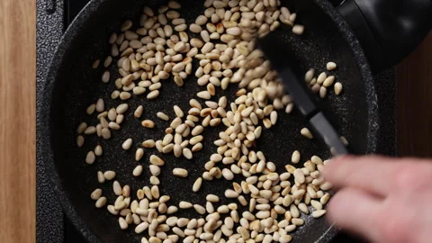 Toasting Pine Nuts In Pan Top View Видео 337191313