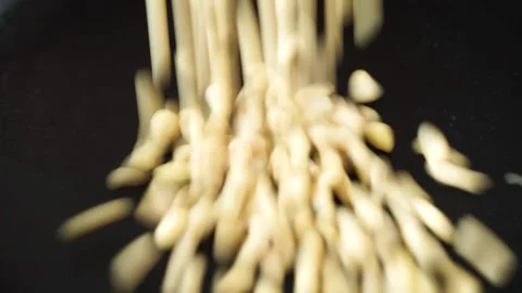 Toasting pine nuts in skillet Stock Footage 156646903