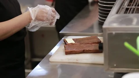 Toasting prepare slice a chocolate chesse toast bread Stock Footage 168403745