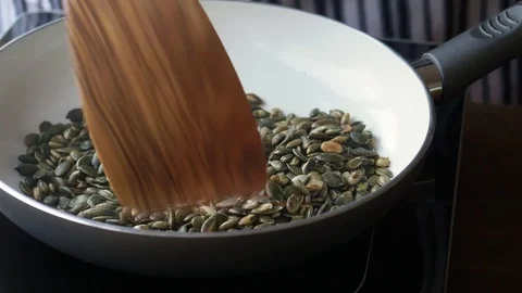 Toasting pumpkin seeds Stock Footage 71645382