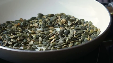 Toasting pumpkin seeds Stock Footage 71646024