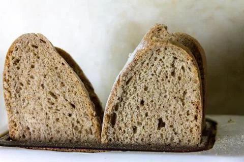 Toasting a slices of bread to make toast in the morning. Concept of breakfast Stock Photos
