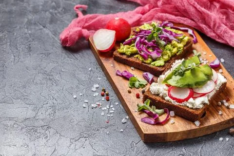 Toasts with Avocado and Vegetables Stock Photos