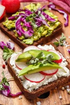 Toasts with Avocado and Vegetables Stock Photos