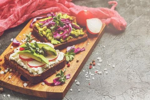 Toasts with Avocado and Vegetables Stock Photos
