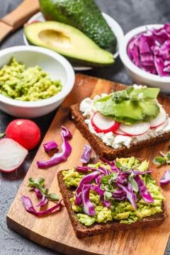 Toasts with Avocado and Vegetables Stock Photos