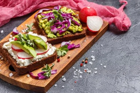 Toasts with Avocado and Vegetables Stock Photos