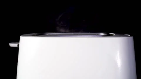         Toasts by breakfast .Modern white toaster with appear hot fried bread .  Stock Footage 124845973