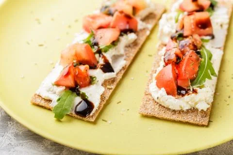 Toasts on crispbread with tomatoes Stock Photos