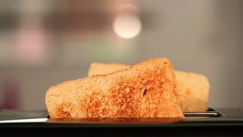 Toasts jumping out of the toaster for breakfast Stock Footage 232916403
