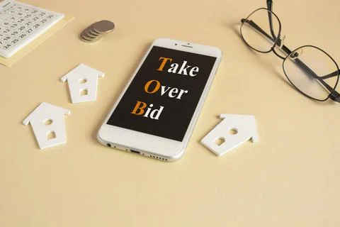 TOB - Take Over Bid. Concept words TOB on the mobile phone screen. Stock Photos