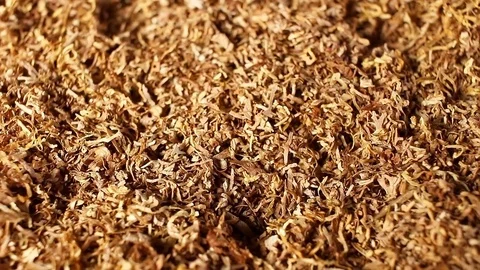 Tobacco grains rotating pattern macro texture background backdrop footage video. Stock Footage 91377955