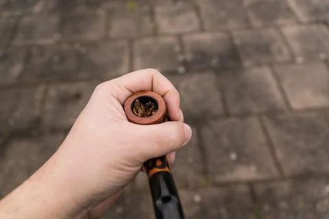 Tobaco pipe in a hand Foto stock