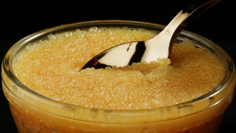 Tobiko, roe flying fish roe full frame macro close up, Sea of red caviar Stock Footage 309639413