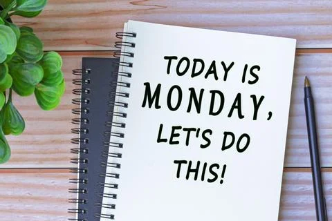 Today is Monday, let's do this written on a notebook with a pen and flower. Stock Photos