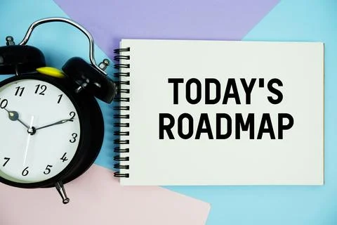 Todays Roadmap text written on notepad with alarm clock flat lay on multico.. Stock Photos