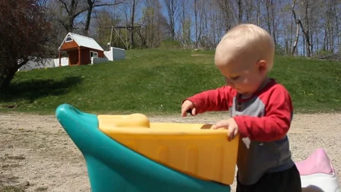 Toddle Tossing Rocks Video stock 130758272