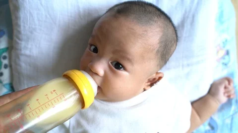 Toddler Drinking Milk Bottle