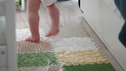 https://images.pond5.com/toddler-baby-foot-massage-mat-footage-179542135_iconl.jpeg