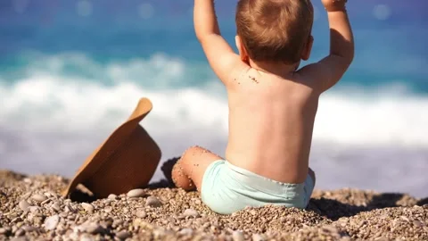 Toddler Boy on Beach with Sun Hat Stock Footage 280228722