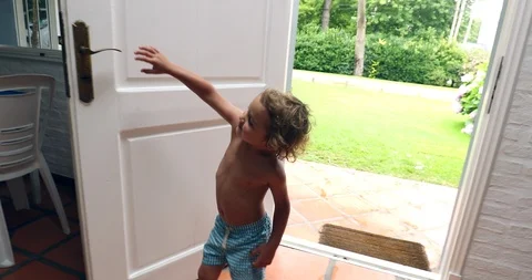 child closing door