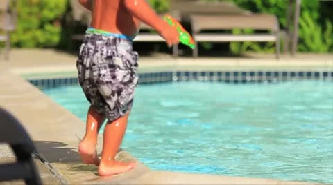 Toddler boy playing around pool4-MVI 8630 Stock Footage 9025947