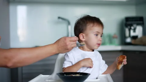 Toddler boy refusing to eat soup Stock Footage 254375640