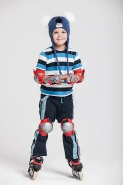 Toddler boy in rollerskates Stock Photos