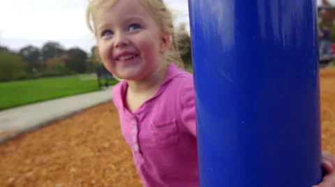 Toddler circles pole Stock Footage 58408173