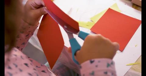 Toddler cutting with scissors and doing crafts Stock Photos