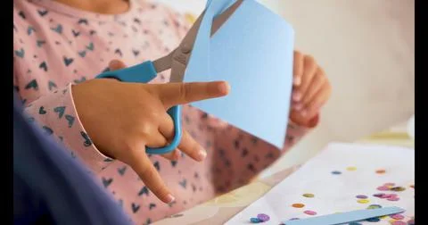 Toddler cutting with scissors and doing crafts Stock Photos